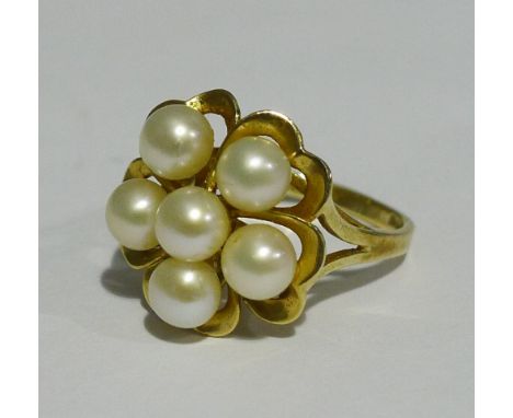 A 14 K gold pearl set flower head ring (4 grammes all in)