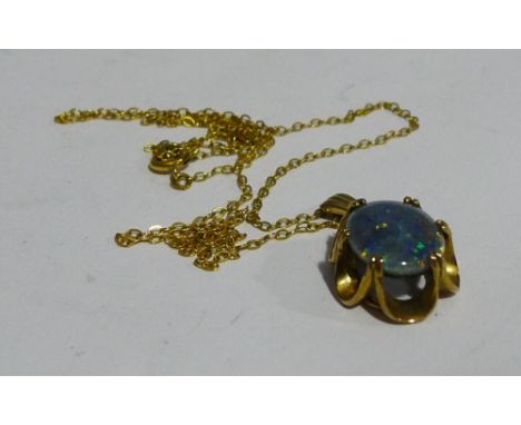 A 9 ct gold opal set pendant on a 9 ct gold chain (3 grammes all in)