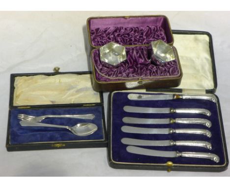 A cased pair of silver salts, Birmingham 1885, a cased silver Christening fork and spoon, Sheffield 1947 and a set of six cas