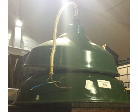 Two green enamel hanging light shades