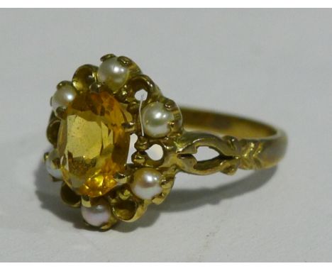 A 9 ct gold seed pearl and citrine set flowerhead ring (3 grammes all in)