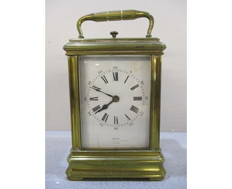 A late 19th century miniature brass carriage clock, with white enamel dial signed Dent, Cockspur? Street, London, the repeati