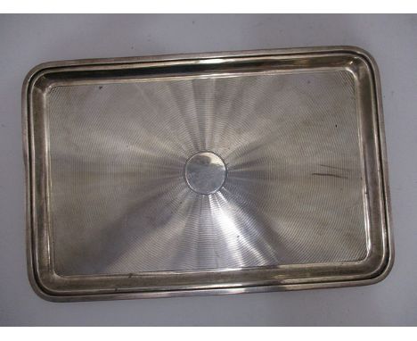 A silver engine turned, decorated tray having a raised edge by Mappin & Webb, London 1917, 10 wide, total weight 374 grams