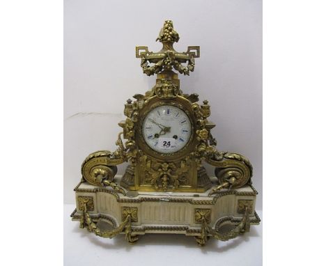 A late 19th century French gilt metal cased mantle clock having a foliate and grape design on a marble base, standing on eigh