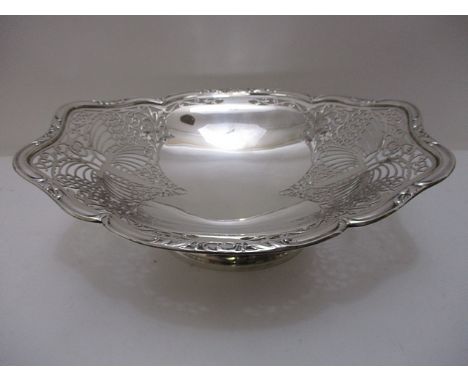 A silver pedestal bowl with pierced butterfly and floral decoration on an oval foot by R F Mosley & Co, 4 h, 11 w, total weig