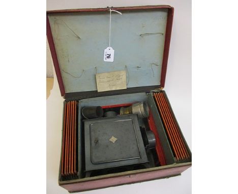 A Bergruder, Bing  GBN Fine Magic Lantern with a blue enamel tin plated body and twenty-two slides, boxed, 5 h, 12 3/4 w, 9 1