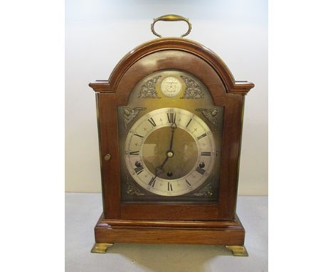 A late 20th century mahogany, chiming bracket clock by Elliott of London, the arched topped, stepped case, three train moveme