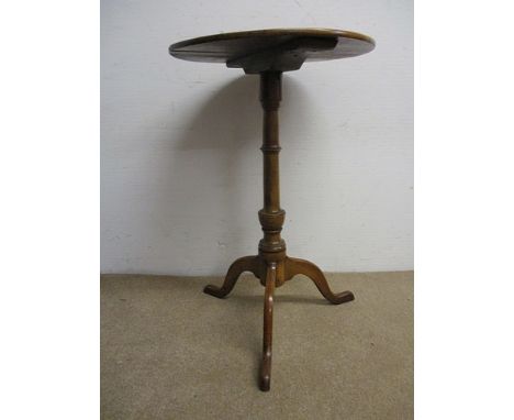 An early 19th century fruitwood and mahogany pedestal table having a ring turned column, raised on a tripod base, 27 1/2 x 17