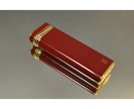 A Cartier Lemust trilogy gold plated lighter, serial no.62631U