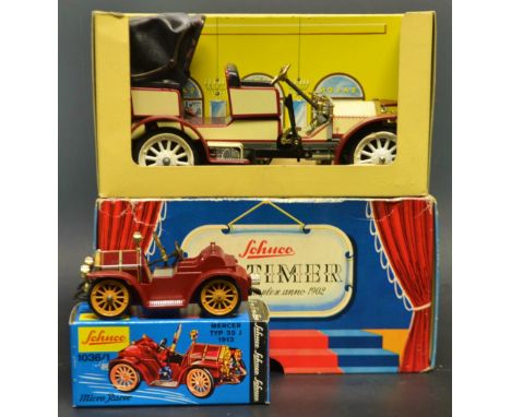 Schuco Clock Work Toys - a 1036/1 Micro Racer Mercer Typ 35 J 1913, red body work, with key;  a  maroon and cream 1229 Old Ti