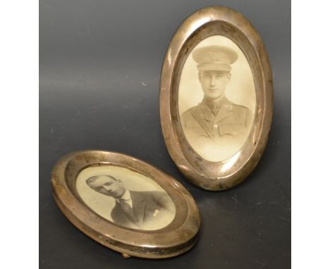 A pair of George V silver oval photograph frames, with WWI military sepia portrait photographs, Birmingham 1919