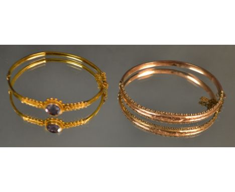 A Victorian 9ct rose gold hinged bangle; another set with a single purple faceted stone, 13g gross (2) 