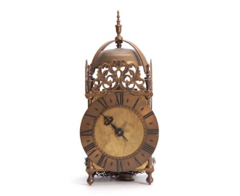 A MID 20th CENTURY LANTERN CLOCK the brass case of typical design having a 6.5" engraved dial with Roman numerals and matted 