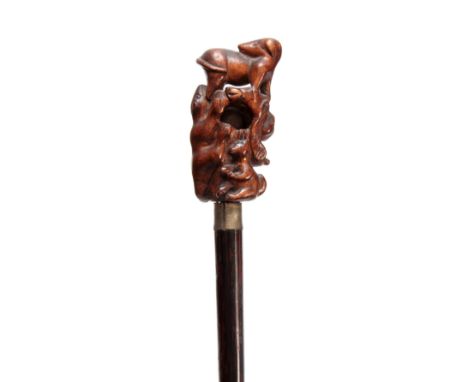 A CHINESE CARVED HANDLED PUZZLE BALL WALKING CANE depicting various animals on simulated coromandel stick 87cm overall