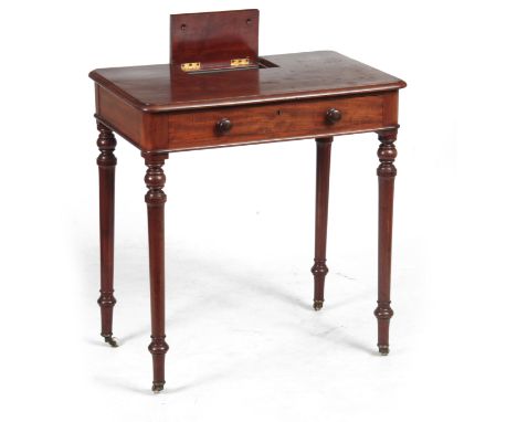 AN EARLY 19TH CENTURY MAHOGANY WRITING TABLE IN THE MANER OF GILLOWS having a lift-up pen and ink compartment to the back abo