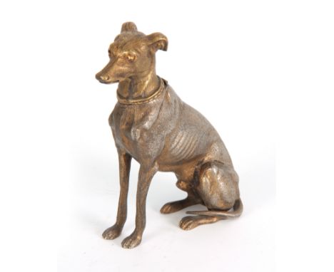 A LATE 19th CENTURY NOVELTY INKWELL modelled as a gilt metal greyhound with amber glass eyes having a hinged head 16.5cm high