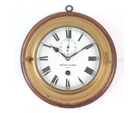 AN EARLY 20TH BRASS SHIPS CLOCK with 5.5" enamel dial signed Bruder Klumax Wien having an eight-day spring driven movement 24