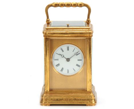 A 19TH CENTURY FRENCH GILT BRASS ENGRAVED GORGE CASE CARRIAGE CLOCK REPEATER with folding handle and engine turned mask enclo