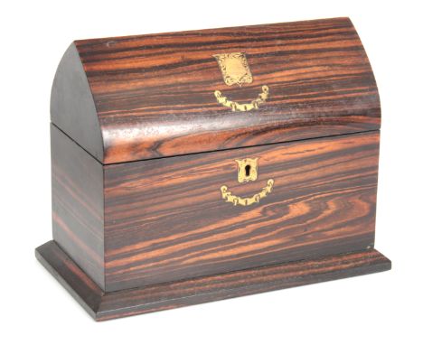 A 19TH CENTURY LANCET SHAPED COROMANDEL TEA CADDY having inlaid brass shield and escutcheon with original fitted interior 20c