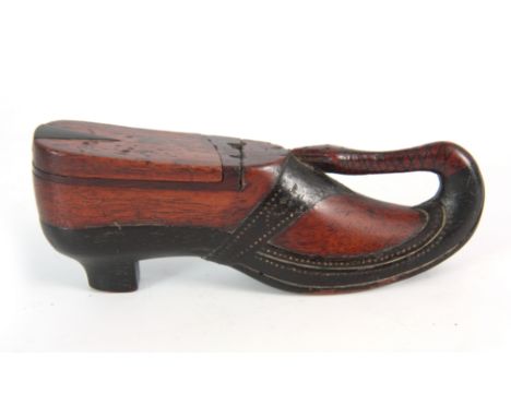 A LATE 19th CENTURY CARVED SNUFF BOX modelled as a shoe with brass pique work decoration, the toe formed as a snake 14.5cm ov