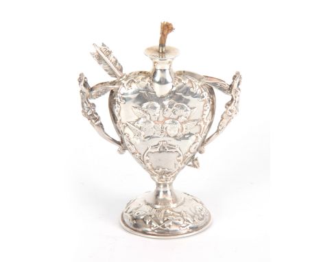 A LATE 19th CENTURY SILVER HEART SHAPED OIL LAMP with relief winged cherub heads and fairy handles on a circular base, remova