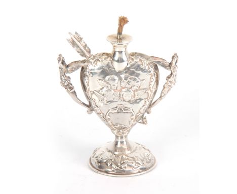 A LATE 19th CENTURY SILVER HEART SHAPED OIL LAMP with relief winged cherub heads and fairy handles on a circular base, remova