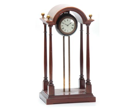 AN EARLY 20th CENTURY FRENCH GRAVITY CLOCK having a mahogany break arch top portico style case enclosing a globular rouge mar