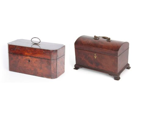 A GEORGE III YEW WOOD VENEERED TEA CADDY of rectangular form with clipped corners and hinged brass handle opening to reveal e