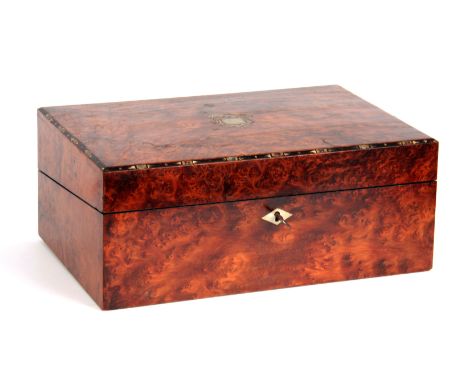 A LATE 19th CENTURY AMBOYNA WRITING BOX with mother-of-pearl and ebony inlaid chamfered edge to the lid opening to reveal a f