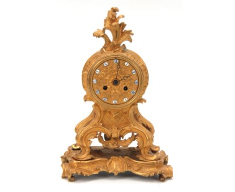 VINCENT. A MID 19tH CENTURY FRENCH ORMOLU MANTEL CLOCK RETAILED BY KLAFTENBERGER, PARIS the gilt rococo style case of scrolli