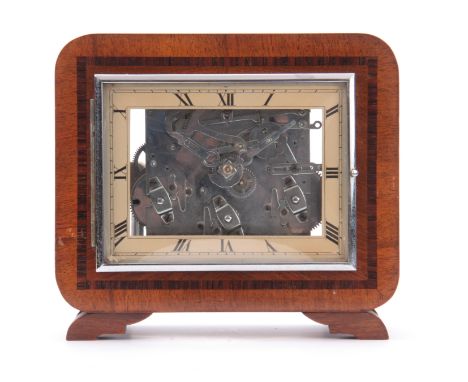 AN UNUSUAL ART DECO WALNUT QUARTER CHIMING MANTEL CLOCK possible made for an exhibition, the case having glass viewing window