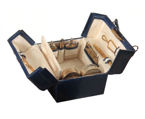 AN EARLY 20th CENTURY MINIATURE BLUE LEATHER AND SILVER GILT VANITY CASE RETAILED BY FINNIGANS, BOND STREET the case with pus