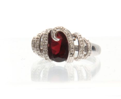 A 14ct WHITE GOLD RUBY AND DIAMOND RING having an oval brilliant-cut ruby entwined in a diamond-encrusted mount app. 6ct ruby
