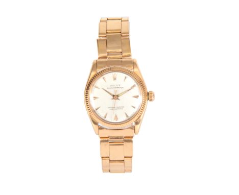 A 1950's MID-SIZE 18CT ROSE GOLD ROLEX OYSTER PERPETUAL WRIST WATCH on 18ct rose gold oyster bracelet, the champagne dial wit