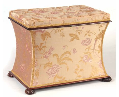 A WILLIAM IV MAHOGANY UPHOLSTERED OTTOMAN having shaped concave sides and button upholstered hinged top; standing on reeded b