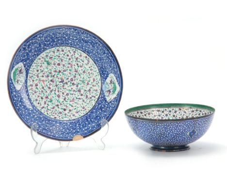 A 19th CENTURY PERSIAN ENAMEL ON COPPER BOWL AND PLATE with floral decoration and perched songbirds, plate measures 24cm diam