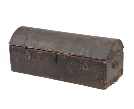 AN 18TH CENTURY DOME TOPPED LEATHER STUDDED TRUNK with hinged lid and side carrying handles 102cm wide 42cm deep 44cm high.