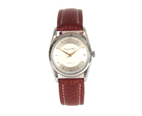A GENTLEMAN'S VINTAGE STAINLESS STEEL IWC AUTOMATIC WRIST WATCH on a brown leather strap, the dial having a cream centre and 
