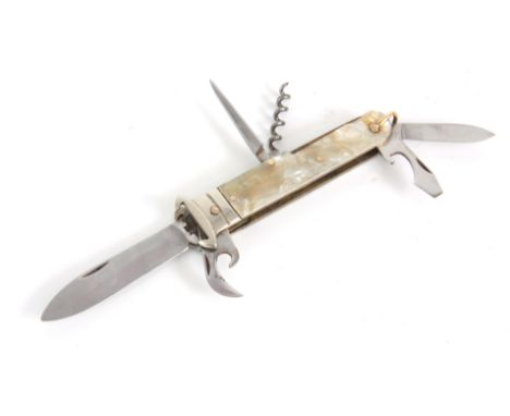 A VINTAGE SPANISH GENTLEMANS MULTI-FUNCTION HUNTING KNIFE with simulated mother of pearl handle having a cartridge extractor 