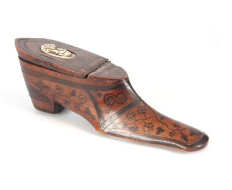 AN 18TH CENTURY WALNUT TABLE SNUFF BOX IN THE FORM OF A SHOE decorated in pique work and the lid set with an oval, ivory plaq