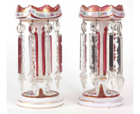 A PAIR OF 19TH CENTURY BOHEMIAN STYLE RUBY AND OPAQUE GLASS LUSTRES with gilt and painted floral decoration; having cut glass