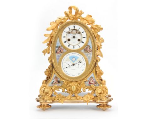 A LATE 19TH CENTURY FRENCH ORMOLU AND PORCELAIN PANELLED MANTEL CLOCK WITH PERPETUAL CALENDAR the case surmounted by leaf wor