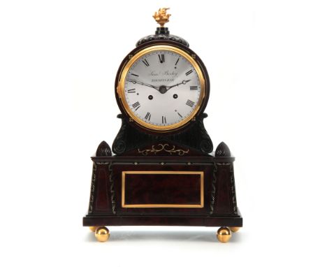 SAMUAL BIRLEY, BIRMINGHAM. A REGENCY BRASS INLAID FLAMED MAHOGANY BRACKET CLOCK with carved gadrooned top surmounted by torch