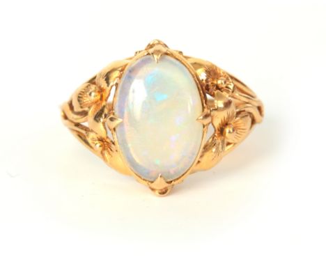 A LARGE LADIES 14CT GOLD OPEL SET RING having a large oval opal on floral setting, opal measure 15mm high, app. 5.2g