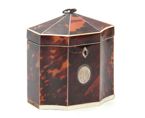 AN EARLY 19TH CENTURY IVORY STRUNG TORTOISESHELL OCTAGONAL TENT TOP TEA CADDY with unusual concave corners, with axe head sha