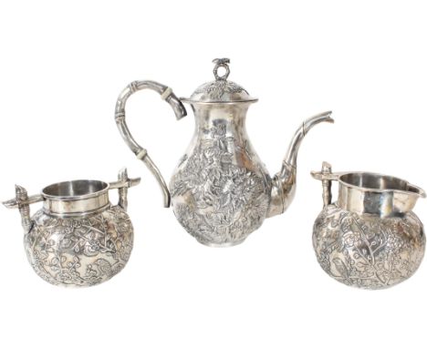 (3) Pc Chinese Silver Tea Set , marked on the underside. Bamboo handles with Japanese cherry blossom motif. The teapot has pe