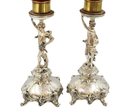 Two Figural Candlesticks, 800 Silver.&nbsp;Interior bobeche appears to be silver plate.&nbsp;Approx 29.48 ozt Size: 5 x 5 x 1
