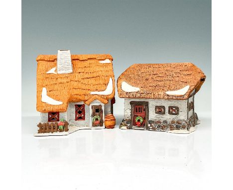 Two separate figures consisting of a village farmhouse and a village barn. Both buildings are made of stone with rooves made 