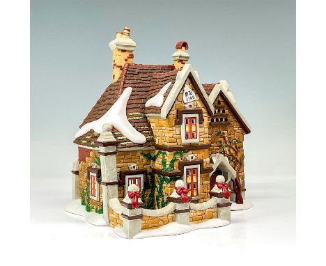 Part of the Dickens' Village Series. Hand-painted porcelain figure modeled as a Victorian style cottage. Department 56 backst
