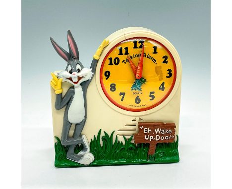 Bugs Bunny alarm clock depicts Bugs Bunny leaning against the clock face. Clock hands are two carrots. Clock face reads Talki